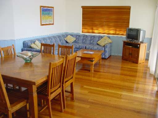 View of dining room and lounge/TV room.